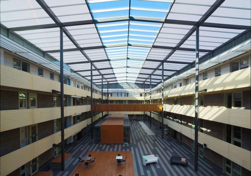 Natural Lighting Building with Commercial Flat Roofing Extensions UNSW New College Kensington, Sydney - refurbishment solved natural lighting Polycarbonate Glazing Energy Health